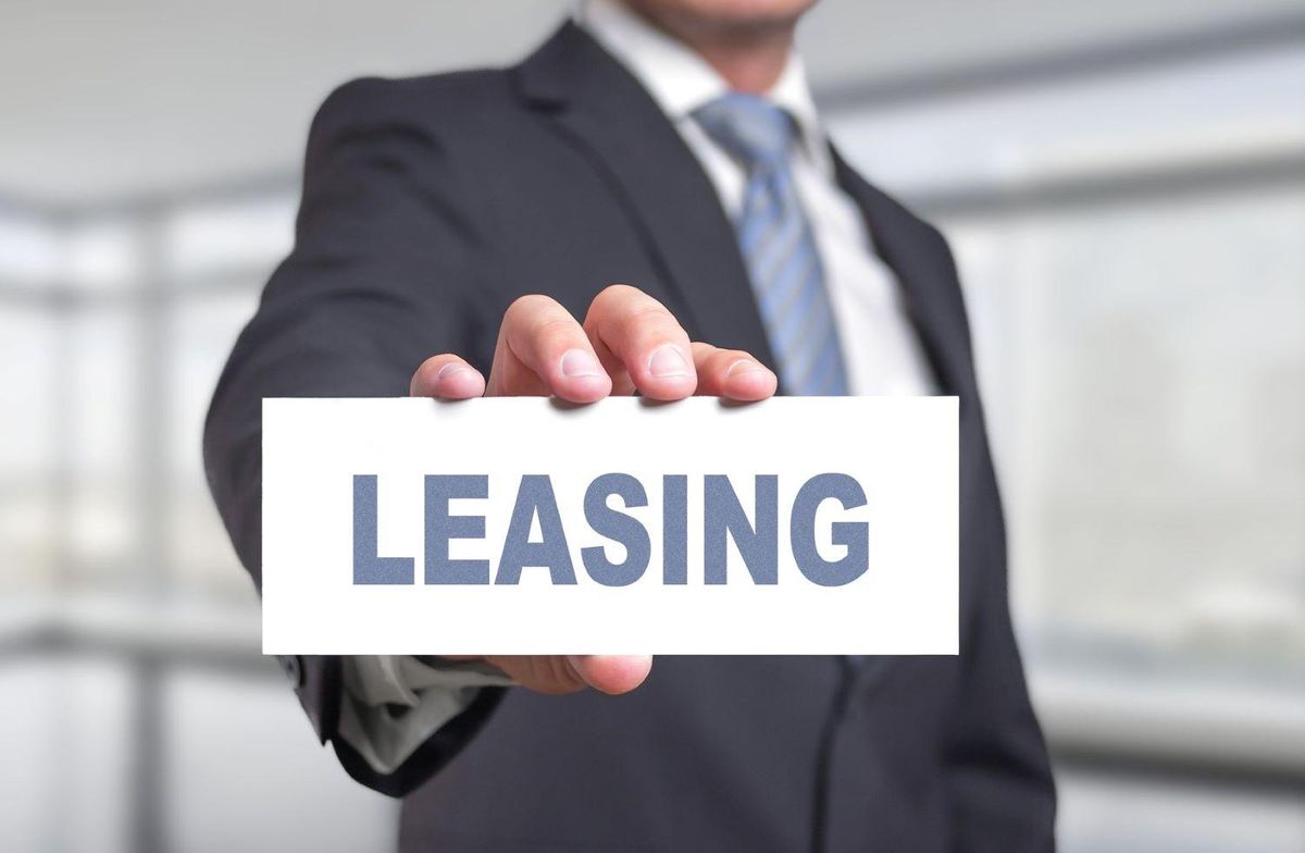Man holding leasing sign